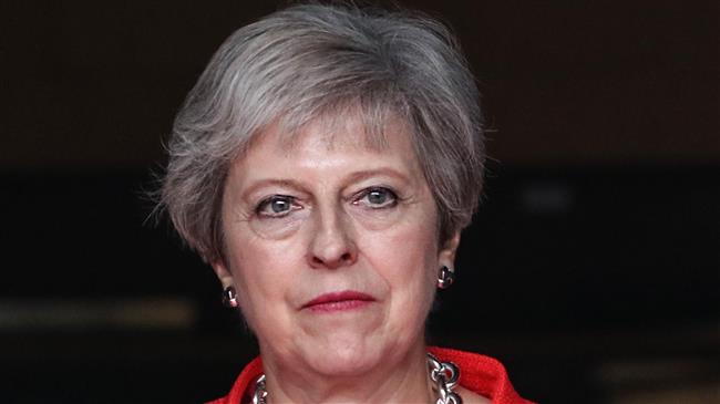 UK PM May downplays impact of no-deal Brexit