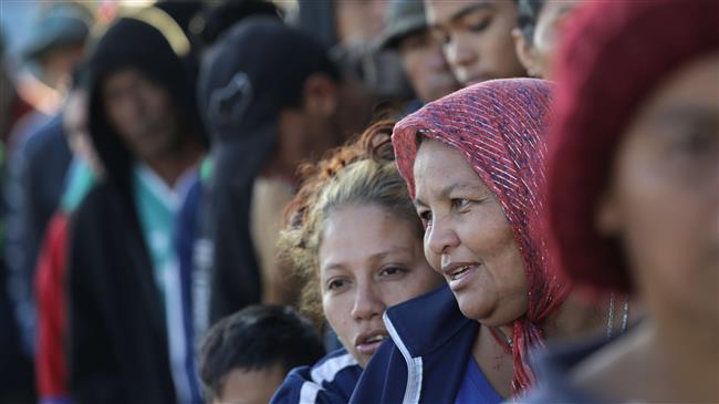 Migrants stalled at US border, some mulling stay in Mexico
