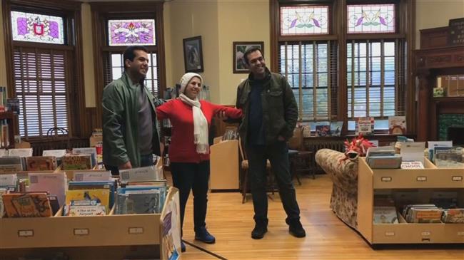 Separated by travel ban, Iranians reunite at border library