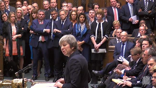 Embattled May admits rout, postpones Brexit vote
