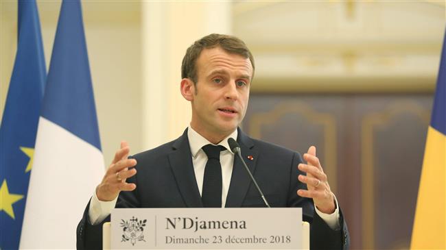 Macron calls for order after yellow vest attack on police