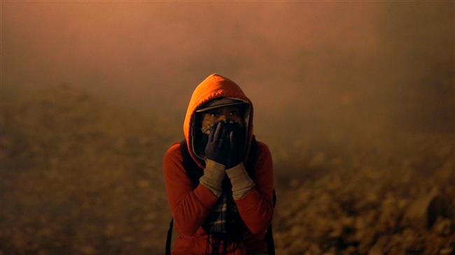 US border agents again use tear gas to repel migrants