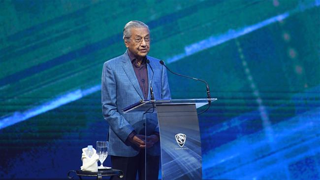 Malaysia draws analogy between Trump wall, Israeli ban