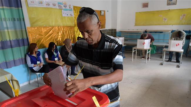 Tunisians casting ballots in parliamentary elections