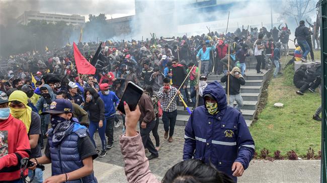 Ecuador's indigenous converge on capital to protest 