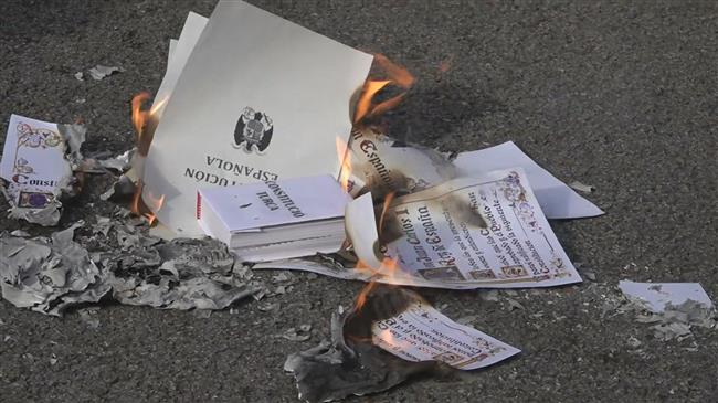 Catalan protesters burn copies of constitution in Barcelona 