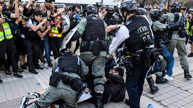 Riot police break up Hong Kong rally for China's Uighurs