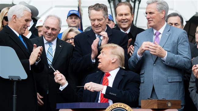 Trump signs USMCA, 'ending the NAFTA nightmare'