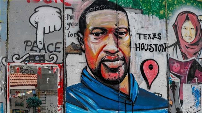 Mural of George Floyd painted on West Bank barrier