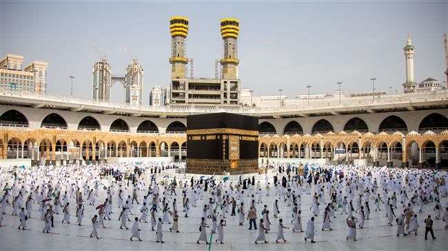 Masked Hajj pilgrims take part in Tawaf after stoning ritual