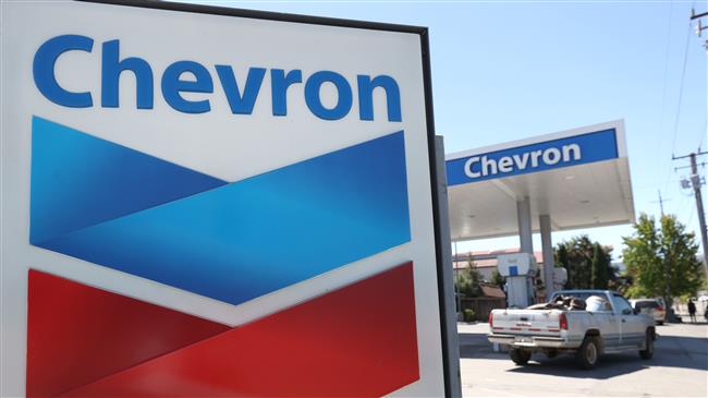Oil rises 1% to hit $60 a barrel, highest in a year