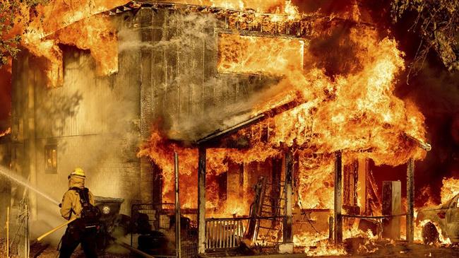 New wildfires burn across US West, as brutal heatwave grips region